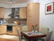 kitchen area in the living room in the 2-rooms flat