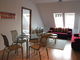 living room with the dining table in the 2-rooms flat